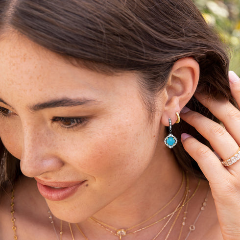 with our huggie hoops in white diamonds <span class='visuallyhidden'>Call or text 323-404-2959 for shopping assistance</span>